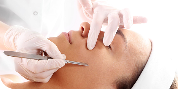 An image of a women getting a dermaplaning treatment