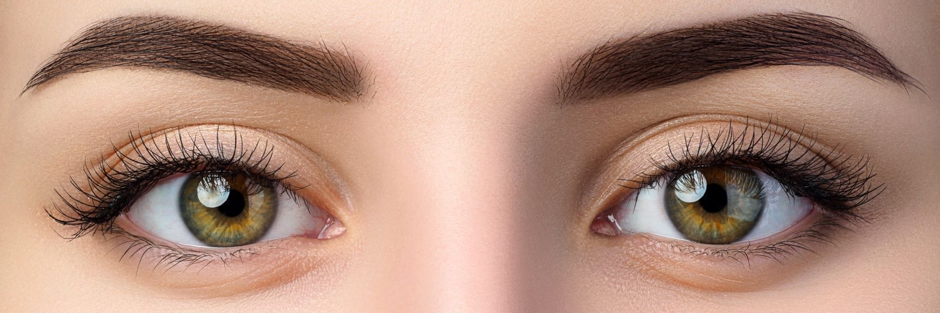 Woman’s eyes and eyebrows after getting brow lamination in Calgary.