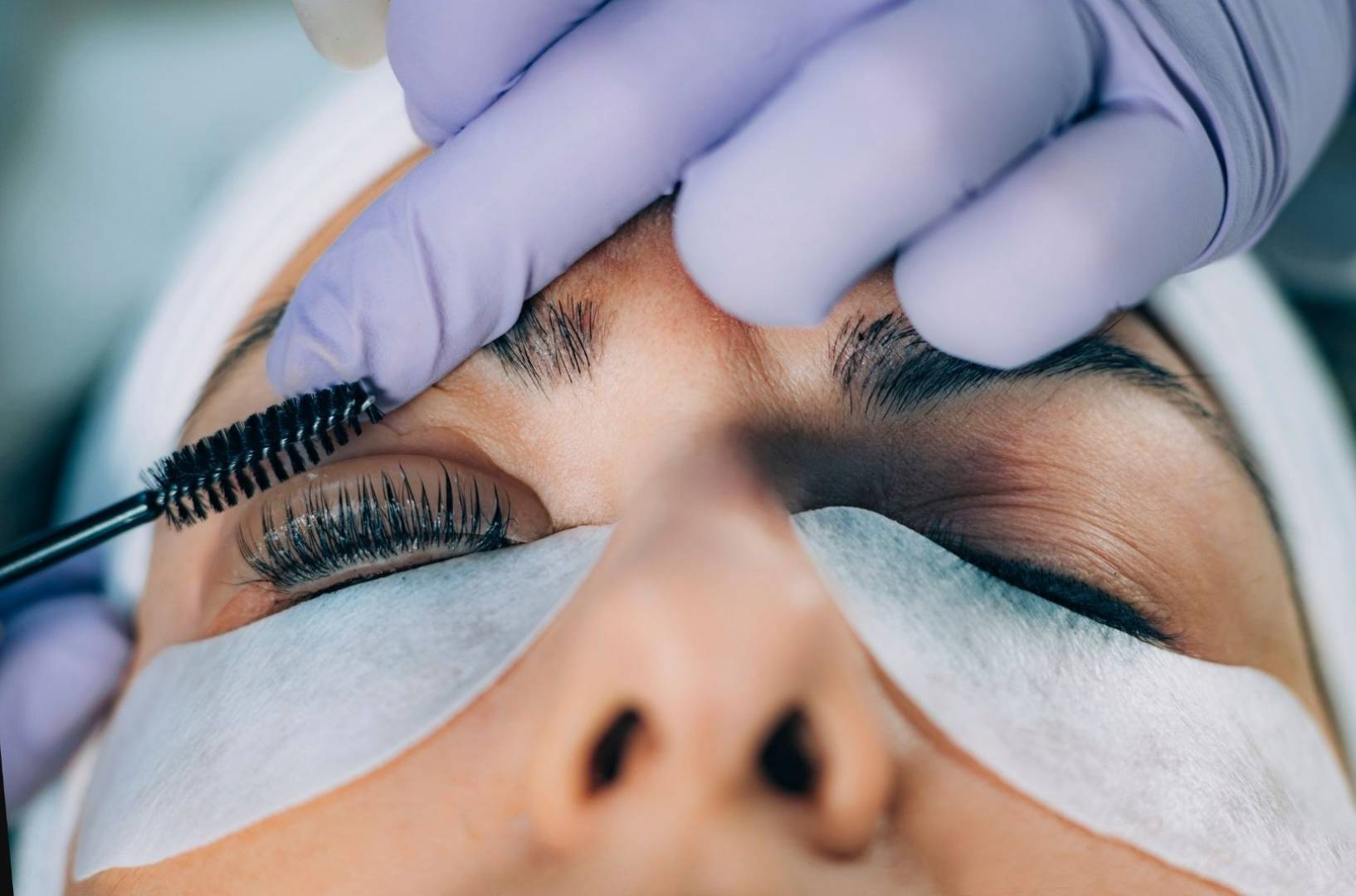 Woman getting lash extensions in Calgary.